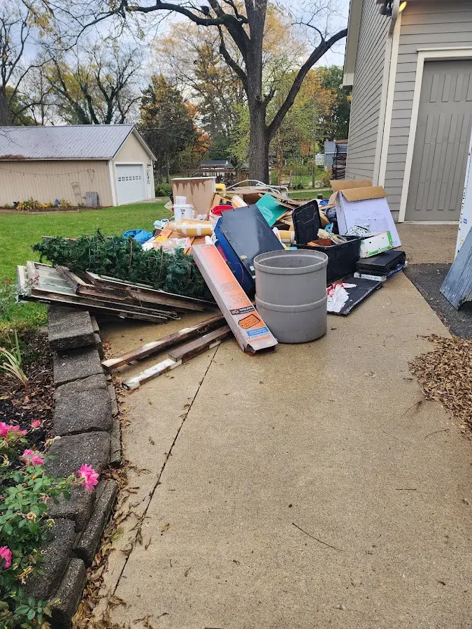 Dumpster being loaded with debris for 3 Yard Dumpster Rental in Beatrice